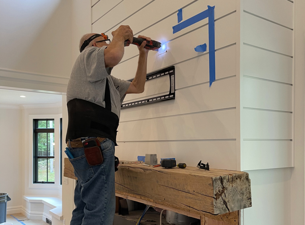 Skilled techician installing a home entertainment system